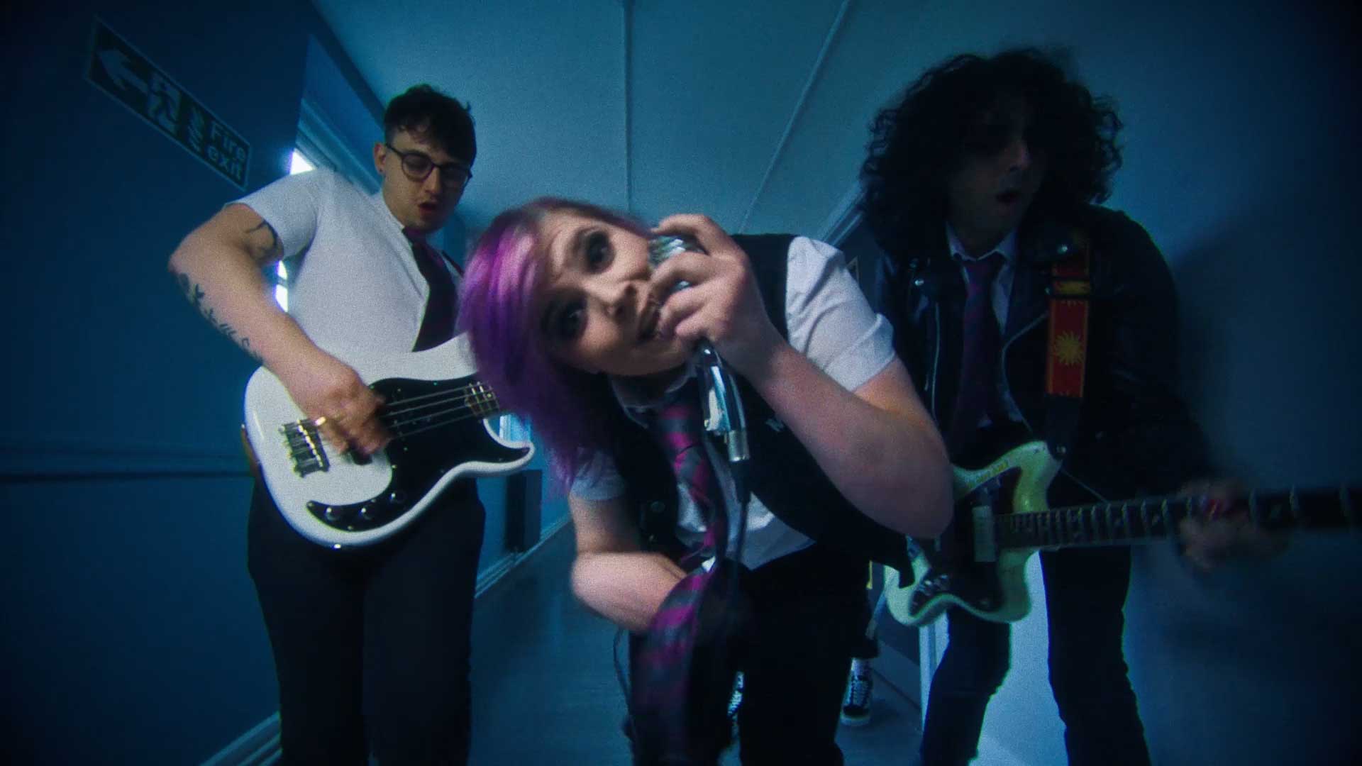 dynamic angled image of band performing in a school corridor